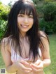 A young woman in a bikini posing for the camera.